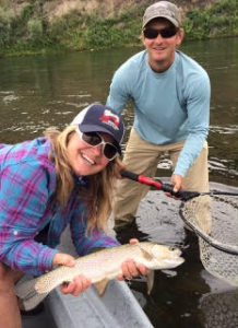 Suzi Curtis fishing in Montana with guide